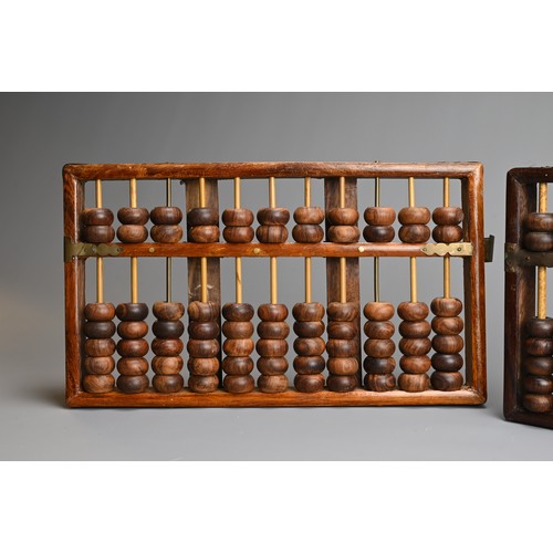 95 - TWO CHINESE HARDWOOD ABACUS, EARLY 20TH CENTURY. One with metal plaque from Lotus Flower Brand, made... 