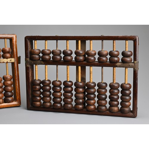 95 - TWO CHINESE HARDWOOD ABACUS, EARLY 20TH CENTURY. One with metal plaque from Lotus Flower Brand, made... 