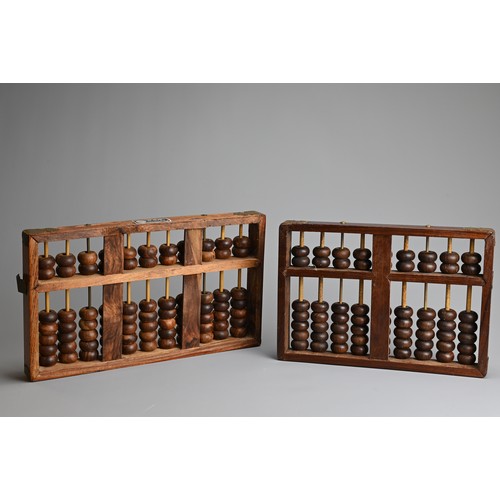 95 - TWO CHINESE HARDWOOD ABACUS, EARLY 20TH CENTURY. One with metal plaque from Lotus Flower Brand, made... 