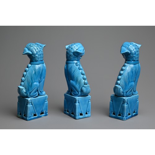 7 - THREE VINTAGE CHINESE TURQUOISE GLAZED PORCELAIN FOO DOGS, LATE 20TH CENTURY. Two males and one fema... 