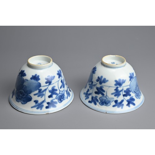 4 - A PAIR OF CHINESE BLUE AND WHITE PORCELAIN CUPS, 19/20TH CENTURY. Of bell form decorated with peony ... 