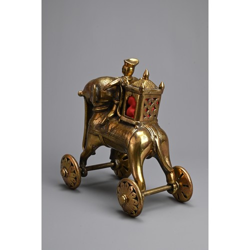 97 - AN INDIAN BRONZE TEMPLE TOY MODEL OF AN ELEPHANT AND RIDER WITH HOWDAH. Standing four square with wh... 