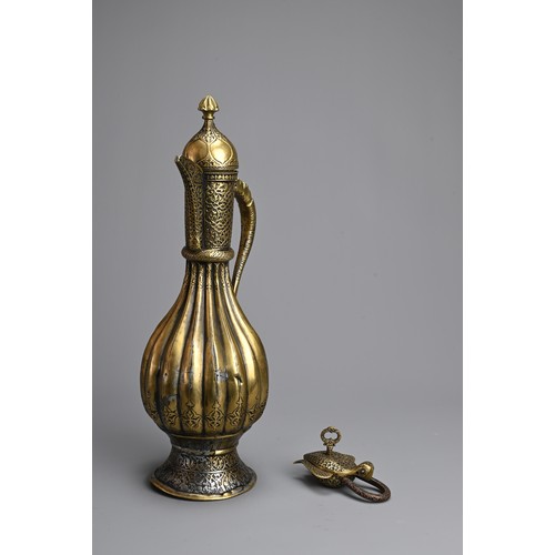 103 - AN ISLAMIC BRASS EWER AND LOCK. The ewer of lobed form  on splayed foot with hinged cover. Together ... 