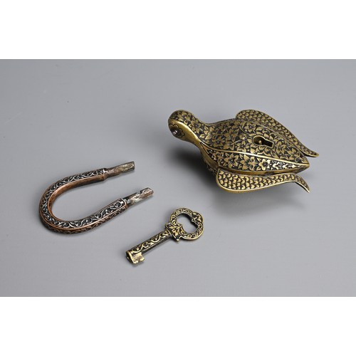 103 - AN ISLAMIC BRASS EWER AND LOCK. The ewer of lobed form  on splayed foot with hinged cover. Together ... 