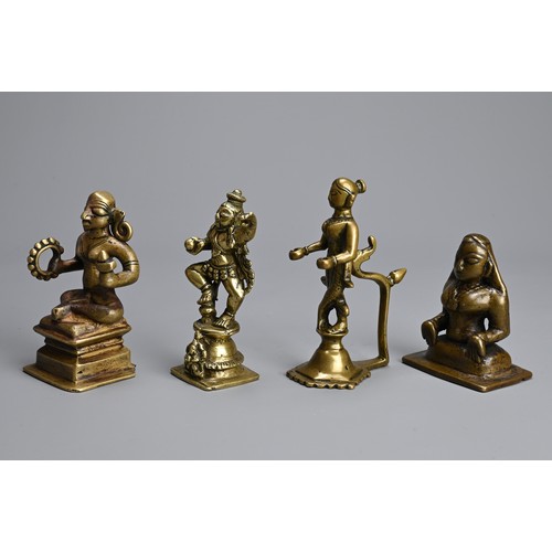 106 - A GROUP OF INDIAN BRONZE BRASS IDOLS OF HINDU DEITIES. Of various forms. 7cm - 11cm tall. (4)