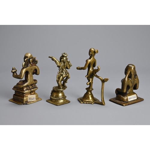 106 - A GROUP OF INDIAN BRONZE BRASS IDOLS OF HINDU DEITIES. Of various forms. 7cm - 11cm tall. (4)