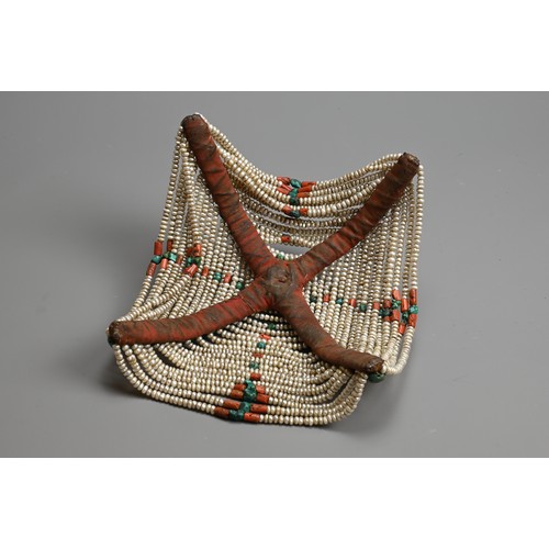 111 - A TIBETAN WOMAN'S HEADDRESS, POSSIBLY AMDO REGION, 20TH CENTURY. Also known as a Jugin. Open work wi... 