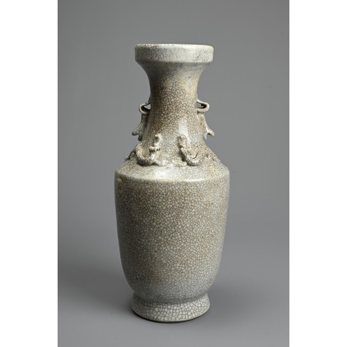 27 - A CHINESE CRACKLE WARE PORCELAIN VASE. Of baluster form on a slightly splayed foot with moulded chil... 