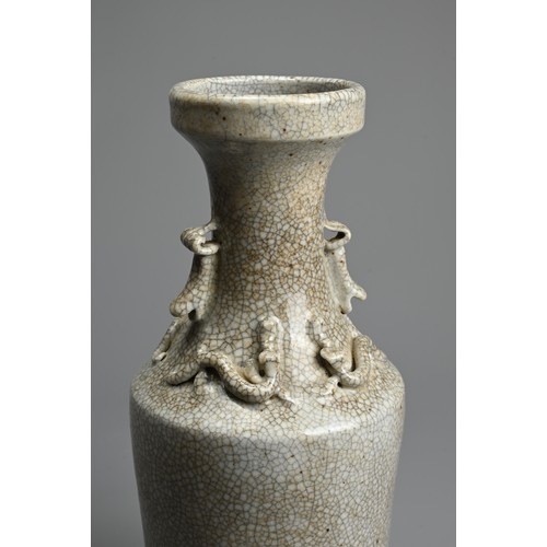 27 - A CHINESE CRACKLE WARE PORCELAIN VASE. Of baluster form on a slightly splayed foot with moulded chil... 