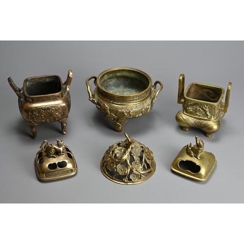 30 - THREE CHINESE POLISHED BRONZE INCENSE BURNERS WITH COVERS, 20TH CENTURY. Of various forms with pierc... 