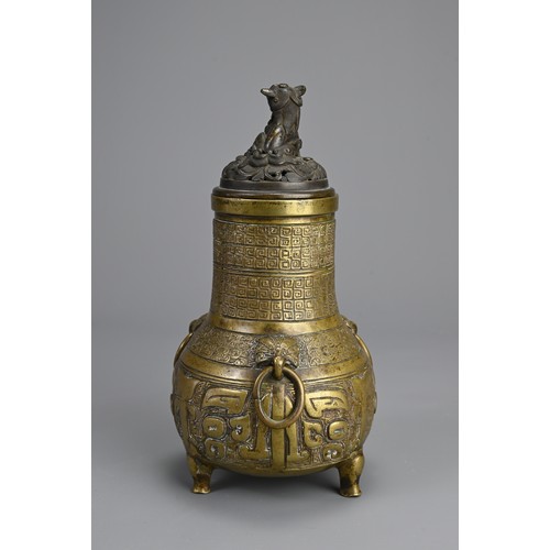 35 - A CHINESE BRONZE TRIPOD JAR AND COVER, 18/19TH CENTURY. Globular body supported on three feet with p... 