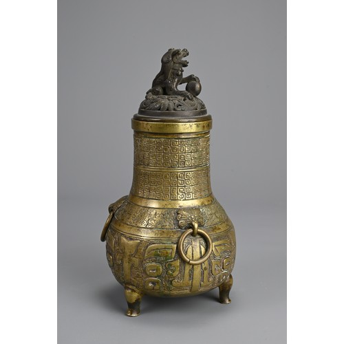 35 - A CHINESE BRONZE TRIPOD JAR AND COVER, 18/19TH CENTURY. Globular body supported on three feet with p... 