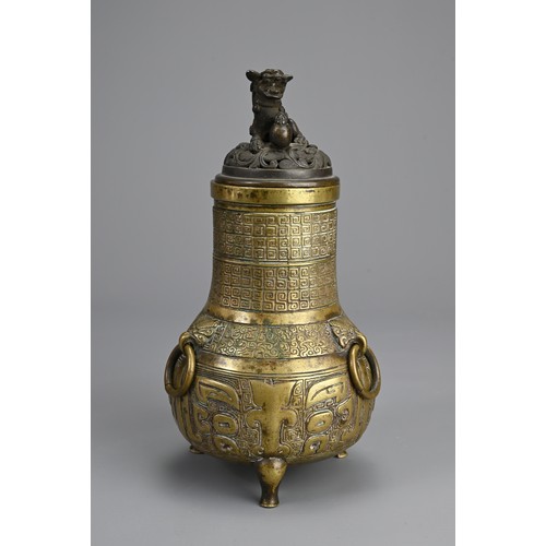 35 - A CHINESE BRONZE TRIPOD JAR AND COVER, 18/19TH CENTURY. Globular body supported on three feet with p... 