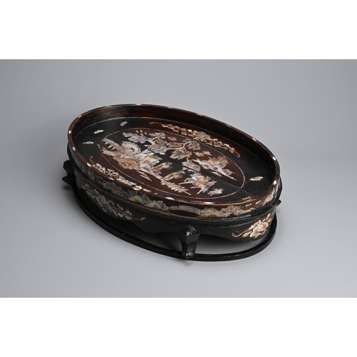 39 - A LARGE CHINESE MOTHER OF PEARL INLAID WOODEN TRAY, 20TH CENTURY. Of raised oval form on four legs w... 