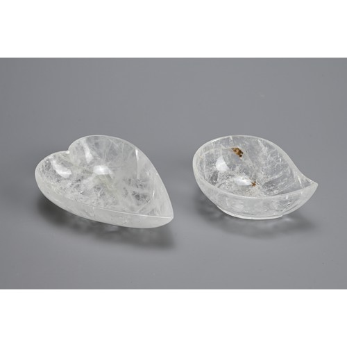 42 - TWO POLISHED ROCK CRYSTAL BOWLS. Clear heart and mango shaped bowls each on a raised foot. 10.5cm an... 