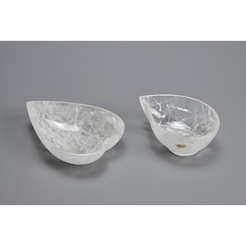 42 - TWO POLISHED ROCK CRYSTAL BOWLS. Clear heart and mango shaped bowls each on a raised foot. 10.5cm an... 