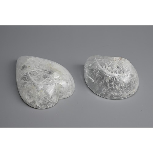 42 - TWO POLISHED ROCK CRYSTAL BOWLS. Clear heart and mango shaped bowls each on a raised foot. 10.5cm an... 