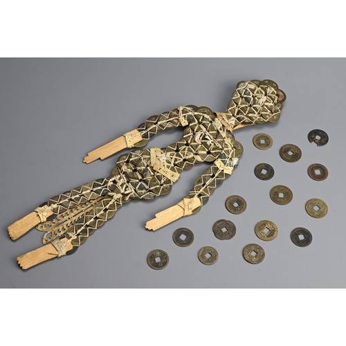 46 - AN INDONESIAN ARTICULATED CASH COIN WEDDING DOLL. Comprised of Chinese Qing dynasty coins strung tog... 