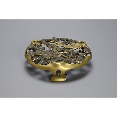 49 - A CHINESE / JAPANESE BRONZE TRIPOD STAND, 19TH CENTURY. Pierced circular stand with prunus flowers. ... 