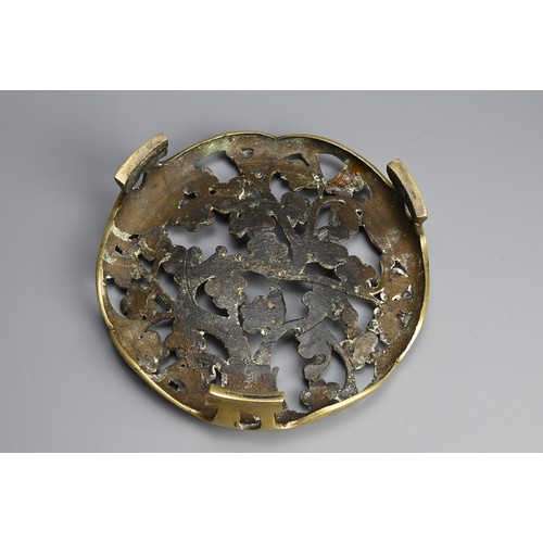 49 - A CHINESE / JAPANESE BRONZE TRIPOD STAND, 19TH CENTURY. Pierced circular stand with prunus flowers. ... 