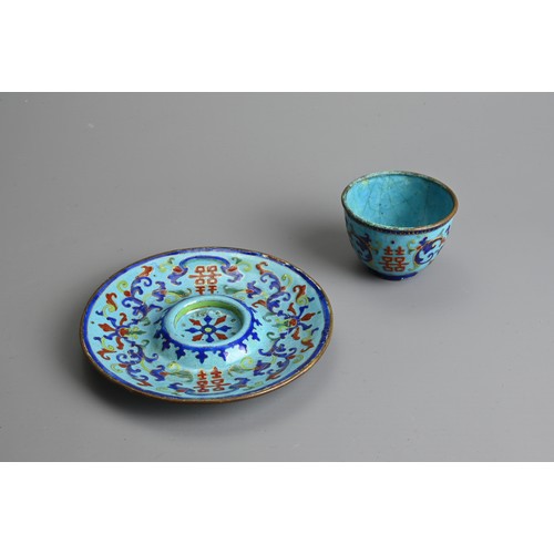 21 - A CHINESE CANTON ENAMEL CUP AND SAUCER, EARLY 20TH CENTURY. Light blue ground decorated with Shuangx... 