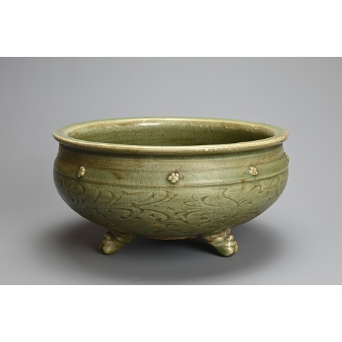 166 - A CHINESE LONGQUAN CELADON TRIPOD CENSER, MING DYNASTY (1368-1644). Thickly potted with carved flora... 