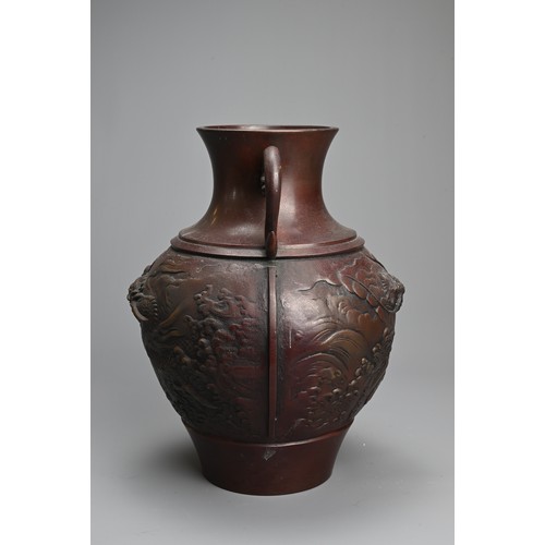 297 - A JAPANESE BRONZE VASE. Of baluster form with handles, decorated with dragons. 27cm tall. Weight 3.7... 