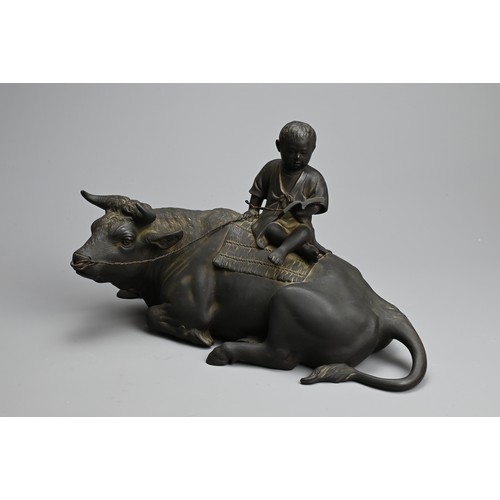 302 - A JAPANESE MEIJI BRONZE OX & BOY, MATSUMORI. Okimono of a boy sitting on an ox reading a book by Mat... 