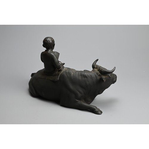 302 - A JAPANESE MEIJI BRONZE OX & BOY, MATSUMORI. Okimono of a boy sitting on an ox reading a book by Mat... 