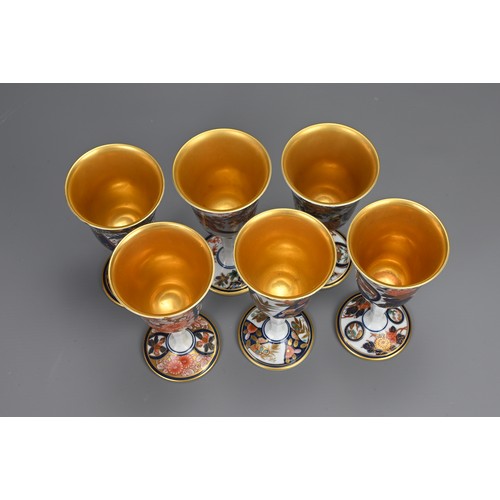 293 - A SET OF SIX JAPANESE ARITA YAKI PORCELAIN WINE CUPS. Individually decorated with various floral sce... 