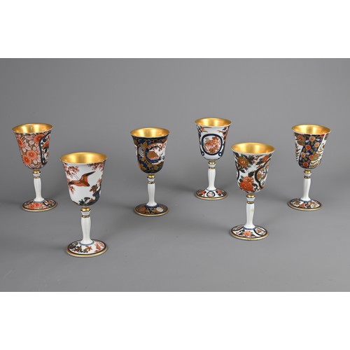 293 - A SET OF SIX JAPANESE ARITA YAKI PORCELAIN WINE CUPS. Individually decorated with various floral sce... 