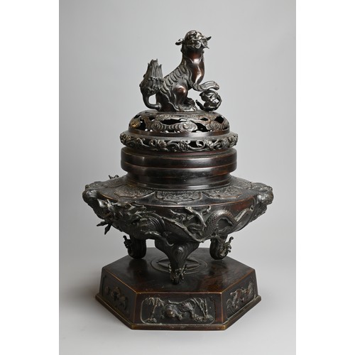 294 - A LARGE JAPANESE BRONZE KORO, MEIJI PERIOD. Heavily cast with dragons mounted on a hexagonal base wi... 