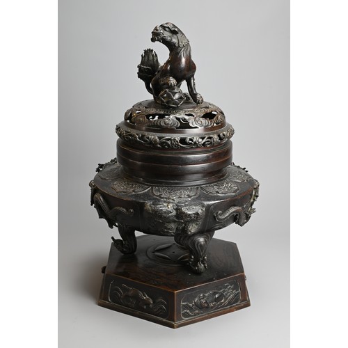 294 - A LARGE JAPANESE BRONZE KORO, MEIJI PERIOD. Heavily cast with dragons mounted on a hexagonal base wi... 