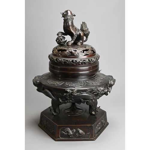 294 - A LARGE JAPANESE BRONZE KORO, MEIJI PERIOD. Heavily cast with dragons mounted on a hexagonal base wi... 