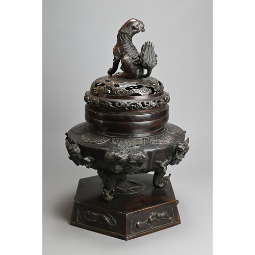 294 - A LARGE JAPANESE BRONZE KORO, MEIJI PERIOD. Heavily cast with dragons mounted on a hexagonal base wi... 