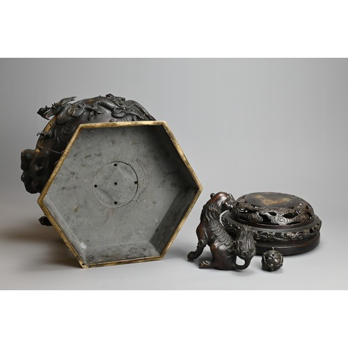 294 - A LARGE JAPANESE BRONZE KORO, MEIJI PERIOD. Heavily cast with dragons mounted on a hexagonal base wi... 