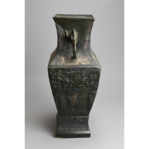 295 - A LARGE CHINESE ARCHAISTIC BRONZE VASE, FANGHU. Of square baluster form decorated with archaic motif... 