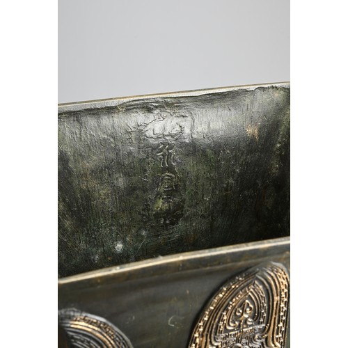 295 - A LARGE CHINESE ARCHAISTIC BRONZE VASE, FANGHU. Of square baluster form decorated with archaic motif... 