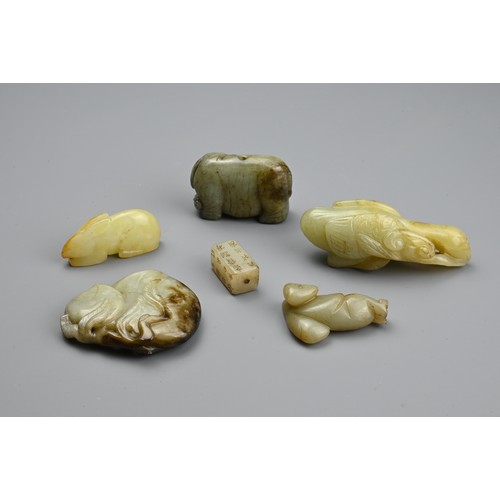 126 - SIX CHINESE CARVED JADE PENDANTS, Comprising: a calligraphic seal pendant, a pale jade rabbit, a cel... 