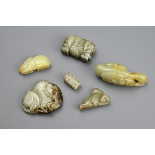 126 - SIX CHINESE CARVED JADE PENDANTS, Comprising: a calligraphic seal pendant, a pale jade rabbit, a cel... 