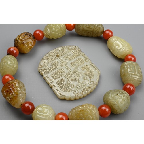 134 - TWO CHINESE CARVED JADE PENDANTS AND A BRACELET. A pale jade pendant of shaped rectangular form, car... 