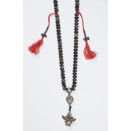 113 - A TIBETAN AGATE BEADED NECKLACE. Composed of dark circular beads with metal spacers, with tassels an... 