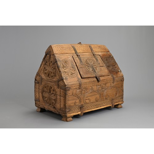 122 - AN INDIAN CARVED WOODEN DOWRY CHEST, 20TH CENTURY. With hinged panel to the roof of the box with iro... 