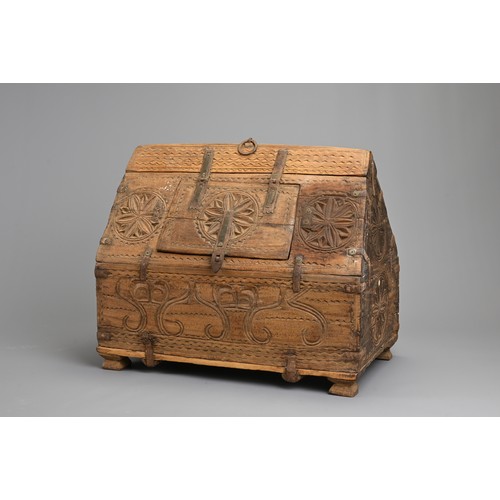 122 - AN INDIAN CARVED WOODEN DOWRY CHEST, 20TH CENTURY. With hinged panel to the roof of the box with iro... 