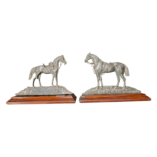 105 - PAIR  OF ANTIQUE METAL HORSE DOOR STOPS ON WOOD