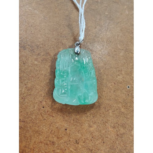 293 - SILVER MOUNTED CARVED JADE PENDANT