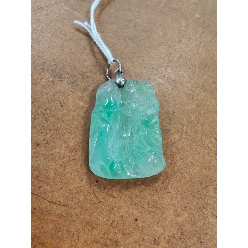 293 - SILVER MOUNTED CARVED JADE PENDANT