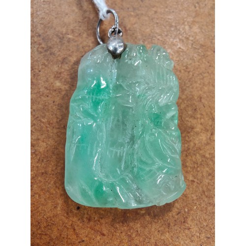 293 - SILVER MOUNTED CARVED JADE PENDANT