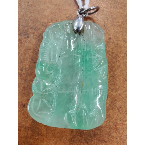 293 - SILVER MOUNTED CARVED JADE PENDANT