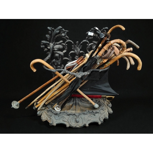 CAST IRON STICKSTAND AND LARGE QUANTITY OF STICKS